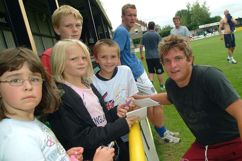 Tigers player Scott Rushton signs autographs for the young fans back in 2006.