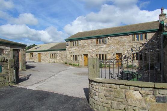 Offers in the region of £475,000 are invited by Purplebricks for this "prestige farmhouse" with four bedrooms, a self-contained flat and countryside views towards Pendle Hill.