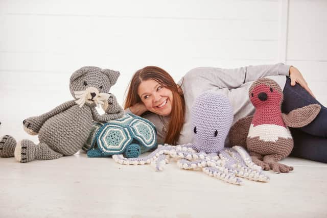 Claire Gelder and her knitted friends