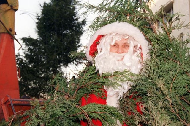Dave Pawson dressed as Santa to promote the Council's plan to recycle Christmas trees in 1999.