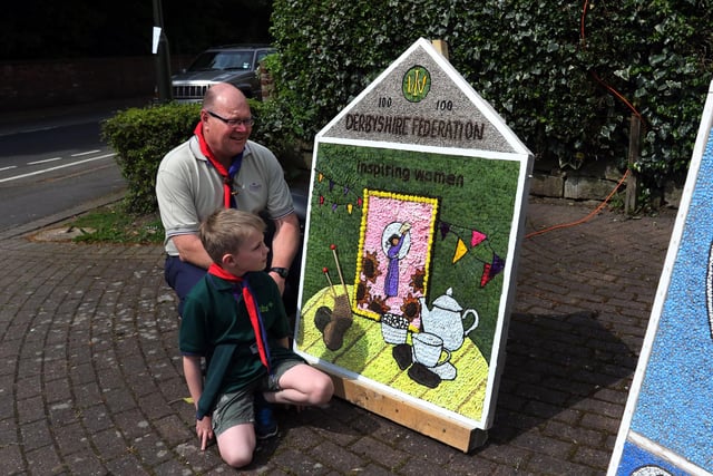 Swanwick scouts Steve Clarke and Jack looking at the WI well dressing in 2018