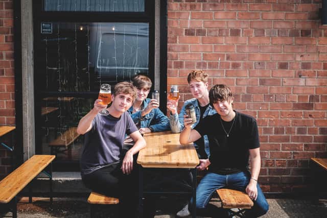 The Sherlocks with thier new beer.