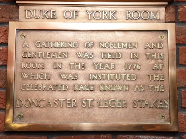 The St.Leger Stakes brass Plaque on display at the Red Lion, Market Place