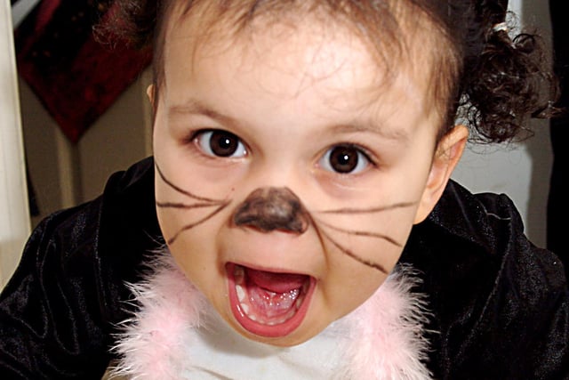 2006: this little girl is dressed up and ready to frighten everyone with a bowl of spiders at Hucknall Day Nursery’s Hallowe’en fancy dress party.