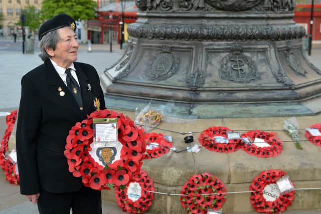Pat Davey (Chairman Sheffield and District Joint Council of Ex-Service Associations) and (Chairman Frecheville Branch Royal British Legion) Lays a wreath At Sheffield war memorial before the Covid-19 pandemic.