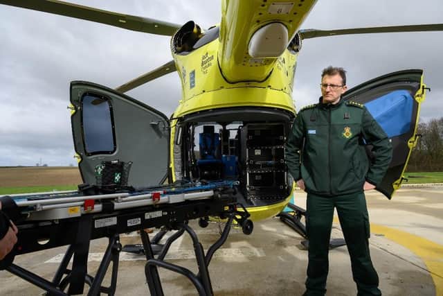 Paul Holmes, Acting HEMS Paramedic and Clinical Operations Manager beside the new AC70 EMS Flex stretcher which is modular and can be easily removed for cleaning or re-configuration.