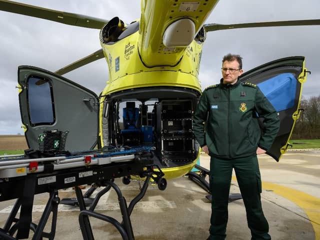 Paul Holmes, Acting HEMS Paramedic and Clinical Operations Manager beside the new AC70 EMS Flex stretcher which is modular and can be easily removed for cleaning or re-configuration.