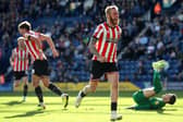 Sheffield United's Oli McBurnie (centre right) celebrates scoring their second goal of the game during the Sky Bet Championship match at Deepdale Stadium, Preston: Isaac Parkin/PA Wire.