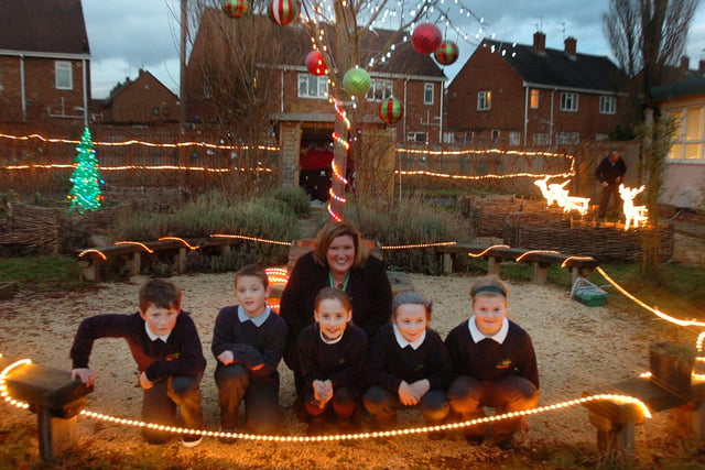 Head teacher Catherine Jones and pupils at Thorney Close Primary School in the schools sensory garden 10 years ago.