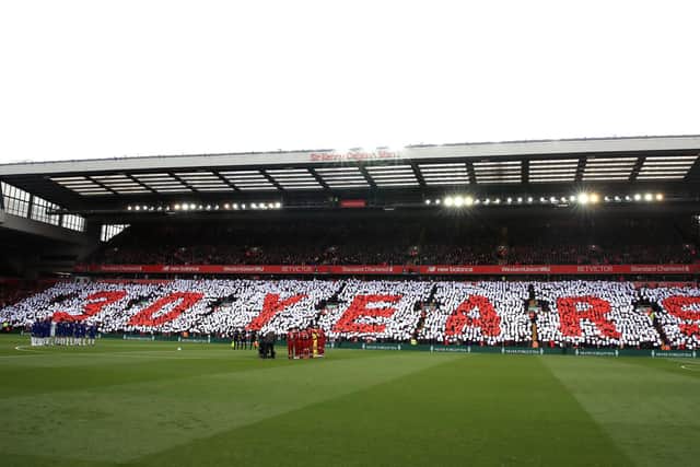 Teams stand for a minute's silence to commemorate the 30th anniversary last year of the Hillsborough disaster before the Premier League match at Anfield, Liverpool. The memorial this year has been cancelled due to coronavirus. Peter Byrne/PA Wire.