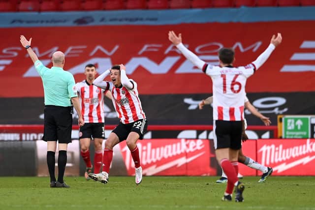 Ethan Ampadu of Sheffield United appeals to referee Lee Mason during The Emirates FA Cup Fourth Round match between Sheffield United and Plymouth Argyle at Bramall Lane (Photo by Stu Forster/Getty Images)