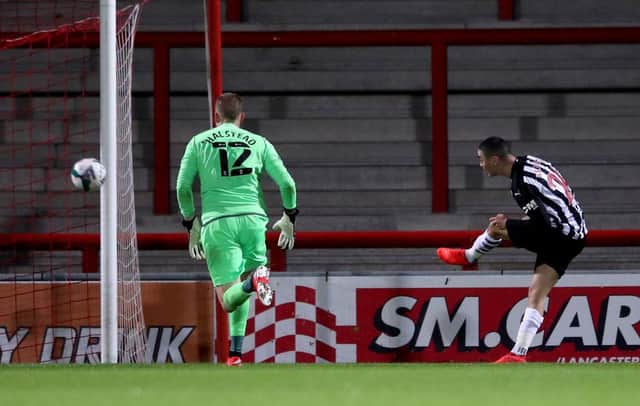 MORECAMBE, ENGLAND - SEPTEMBER 23: Miguel Almiron scores his sides second goal during the Carabao Cup third round match between Morecambe and Newcastle United at Globe Arena on September 23, 2020 in Morecambe, England.
