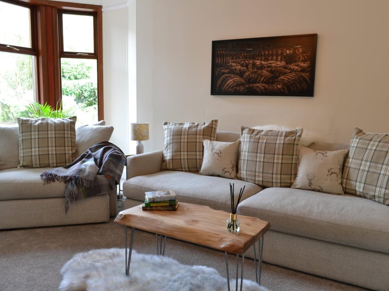 Oversize sofa and snuggle seat in the TV room