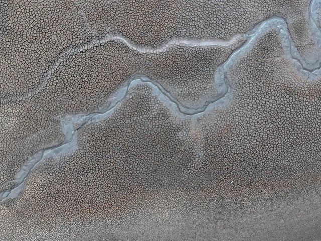 The drought has revealed an extensively exposed and cracked bed.