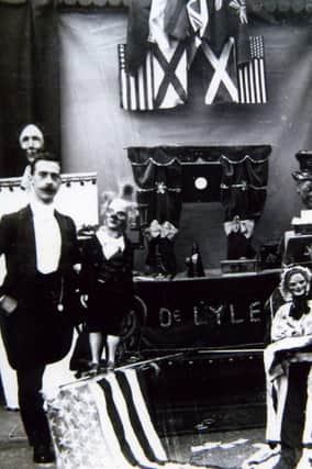 Professor De Lyle with puppets and props - he used this image on a card advertising his act