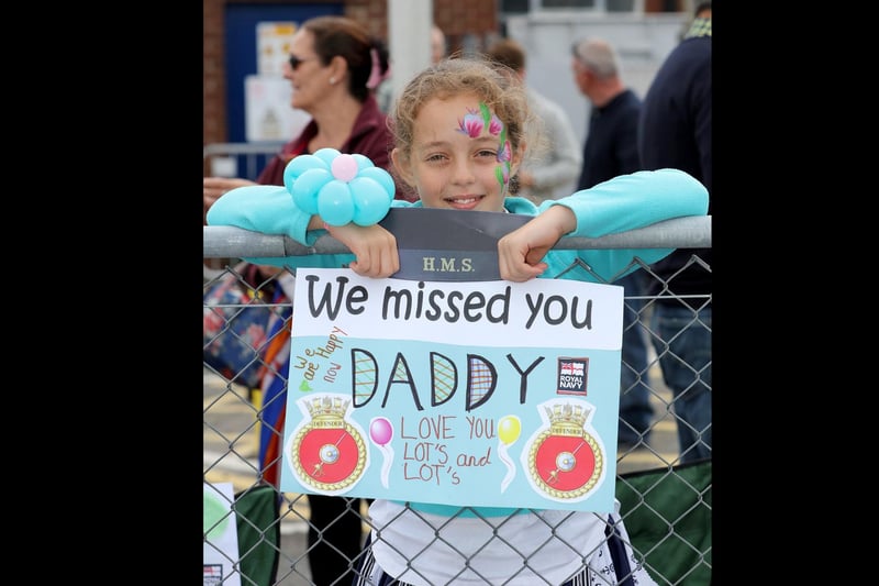 HMS Defender returns home in 2016. Pictured Emily Anderson Welcomes home her father
Portsmouth-based warship HMS Defender returned home 8th July 2016 from a nine month deployment to the middle east carrying out security operations.
The Band of Her Majesty’s Royal Marines Portsmouth performed on the jetty as the crowds eagerly awaited the return of sailors on board.
Hundreds of proud family and friends waved and cheered as the ship came alongside, clearly delighted to welcome their loved ones home.
Image: LPhot Kyle Heller