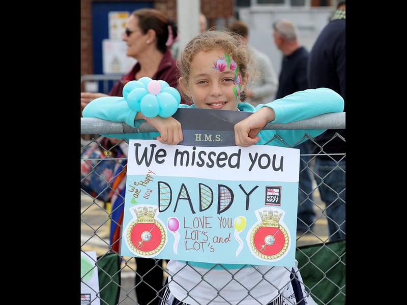 HMS Defender returns home in 2016. Pictured Emily Anderson Welcomes home her father
Portsmouth-based warship HMS Defender returned home 8th July 2016 from a nine month deployment to the middle east carrying out security operations.
The Band of Her Majesty’s Royal Marines Portsmouth performed on the jetty as the crowds eagerly awaited the return of sailors on board.
Hundreds of proud family and friends waved and cheered as the ship came alongside, clearly delighted to welcome their loved ones home.
Image: LPhot Kyle Heller