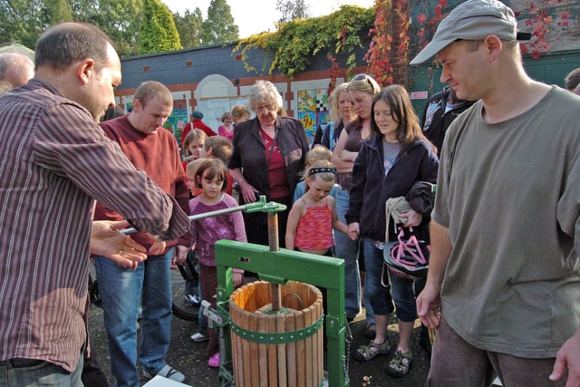 The apple press causing lots of interest to visitors at a  Meersbrook Park Apple Day