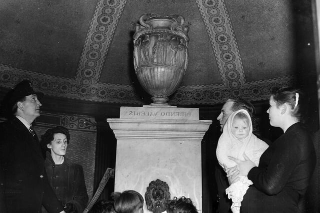 Visitors enjoying the interior of St Bernard's Well in May 1957.