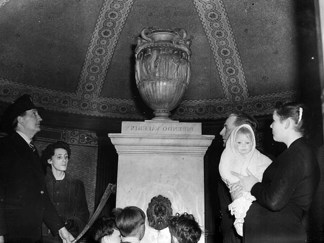 Visitors enjoying the interior of St Bernard's Well in May 1957.