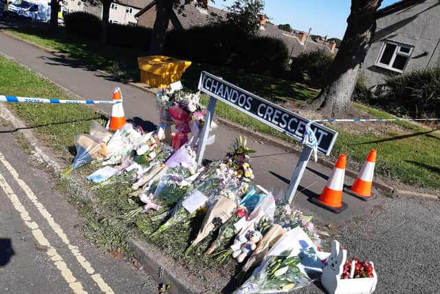 Flowers left close to the house where the bodies of a woman and three children were found in KIllamarsh, near Sheffield
