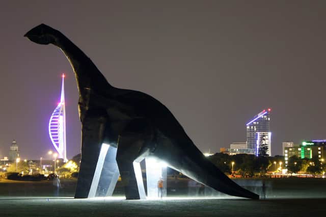 A night shot of Ultrasaurus on Southsea Common with the Portsmouth skyline beyond. Picture: Jon Eastham
