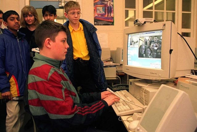 Pictured is High Storrs pupil Ashley Bolton (13) talking to German friends on the internet via a camera mounted on top of the screen, March 1998
