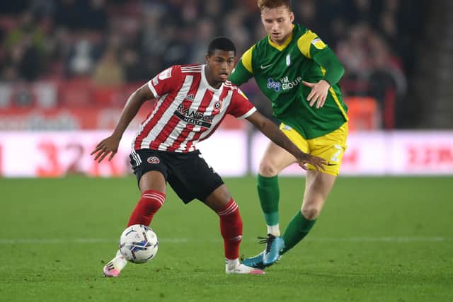 SHEFFIELD, ENGLAND - SEPTEMBER 14: Rhian Brewster of Sheffield United is put under pressure by Sepp van den Berg of Preston North End during the Sky Bet Championship match between Sheffield United and Preston North End at Bramall Lane on September 14, 2021 in Sheffield, England. (Photo by Laurence Griffiths/Getty Images)