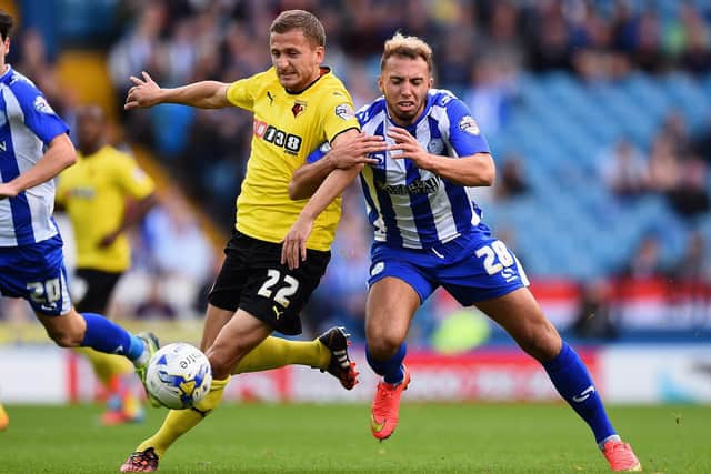 Oldham Athletic midfielder Hallam Hope battles with future Owl Almen Adbi -then of Watford - during his brief stint with Sheffield Wednesday.