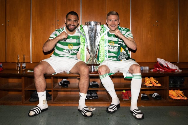 Celtic defensive partners Cameron Carter-Vickers and Carl Starfelt pose with the cinch Premiership trophy inside the Parkhead changing rooms