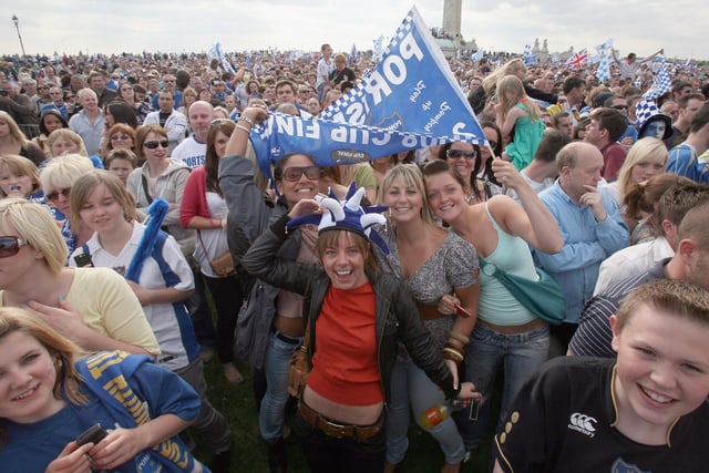 All smiles. Portsmouth fans celebrate as their team arrive in a open top bus as part of their victory parade at Southsea Common following their win in the FA Cup Final 2008 on May 18 2008 in Portsmouth, England. Picture: Matt Cardy/Getty Images