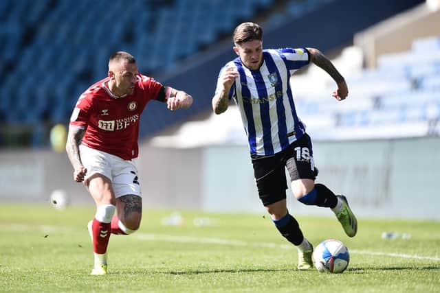 Jack Hunt attempts to take the ball from Sheffield Wednesday's Josh Windass during his time at Bristol City.