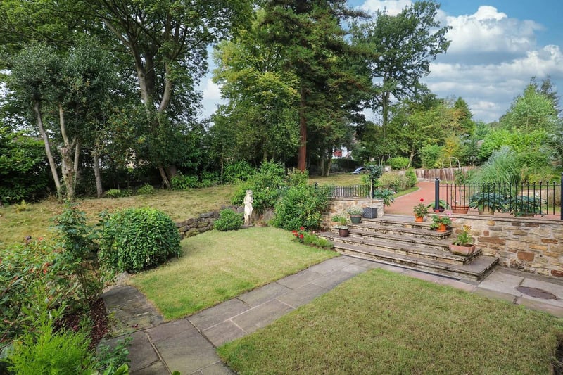 The landscaped grounds are another lovely feature of this impressive home.