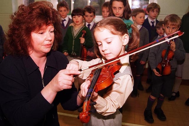 Pictured at  Birkdale School, Clarke Drive, Sheffield, where violin teacher Iona Sherwood-Jones is seen with Olivia Moore 5, and the rest of a new class (February 1998)
