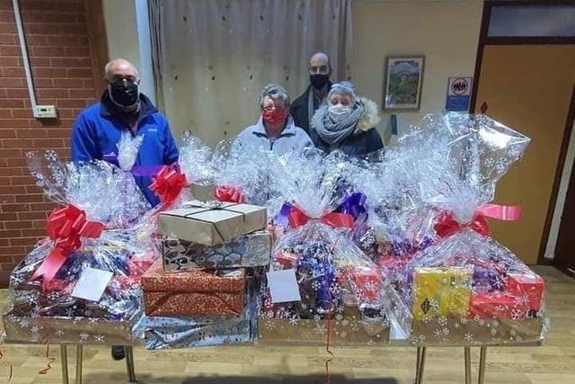 The hampers were filled with items such as mince pies, chocolate selection boxes, festive biscuits, crackers, chocolate logs, hot chocolate, milk, tea bags, honey, jam, marmalade, sweet treats and a Christmas card.