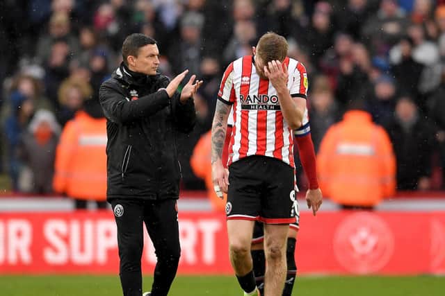 Paul Heckingbottom, the manager of Sheffield United manager, with striker Oli McBurnie following the defeat by Luton Town: Gary Oakley / Sportimage