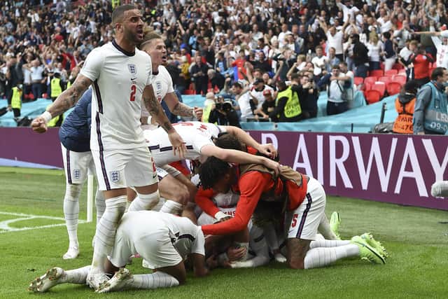 England's Kyle Walker and teammates celebrate after Harry Kane scored his side's 2nd goal during the Euro 2020 soccer championship round of 16 match between England and Germany, at Wembley stadium. (Andy Rain, Pool via AP)