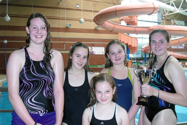 Selby Tiger Sharks pictured at the 2011 Doncaster gala are (back, from left) Hannah Buckley, Samantha Owen, Lauren Buckley, Annabelle Owen and Emma Tune with her trophy for Top Girl.