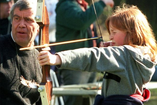 Charlotte Tonge having a go at archery at the Sandall Beat Woods in 2000.