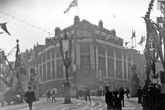 Cole Brothers department store, in its original spot on the corner of Fargate and Church Street, in July 1905. The streets are decorated for the Royal visit of King Edward VII and Queen Alexandra. Image: Picture Sheffield.