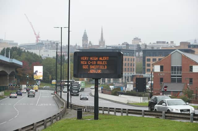 A coronavirus advice sign in Sheffield city centre - PA