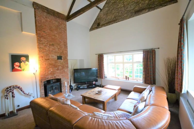 A great sized room enjoying exposed beam work to the ceiling and a feature fireplace with exposed bricks and a gas coal effect stove. Front facing wooden sash window and an internal feature window.