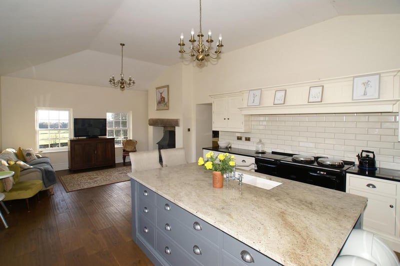 Having front and rear-aspect UPVC double-glazed sliding sash windows and side-aspect bi-fold doors opening onto the gardens, the kitchen/breakfast room, a "delightfully light and spacious room" has light oak flooring following through from the dining room.