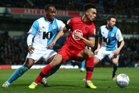 BLACKBURN, ENGLAND - DECEMBER 23: Antonee Robinson of Wigan Athletic turns away from Ryan Nyambe of Blackburn Rovers during the Sky Bet Championship match between Blackburn Rovers and Wigan Athletic at Ewood Park on December 23, 2019 in Blackburn, England. (Photo by Lewis Storey/Getty Images)