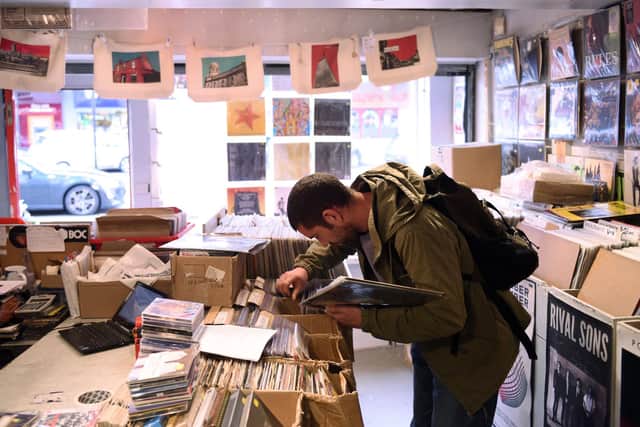A customer peruses vinyl for sale in the music shop 'Record Collector' in Sheffield. Picture: OLI SCARFF/AFP via Getty Images.
