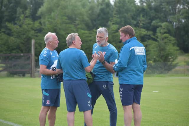 Neil Warnock speaks to his new coaching team at Middlesbrough.