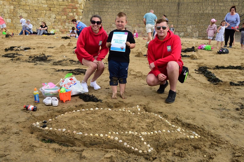 Looking cool in shades at the 2019 Hartlepool Carnival sand sculpture competition on the Fish Sands. The judges were lifeguards Arron Boagey (right) and Courteney Thompson (left) with creative competitor Jackson Cawley.