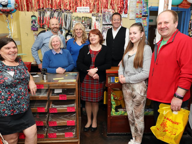 The Searle family including manager Steve Searle, back left, with customers, front left to right, Salina Coleman, Elizabeth Jones, 15, and Andrew Jones. U Need Us, Arundel Street, on its last day of trading.