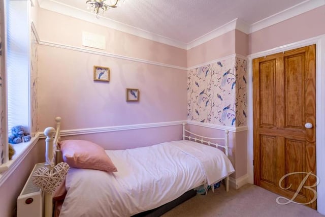 The third bedroom is cosy and compact. It comes complete with a carpeted floor, central-heating radiator and window to the front of the house.