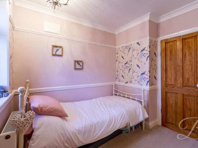 The third bedroom is cosy and compact. It comes complete with a carpeted floor, central-heating radiator and window to the front of the house.